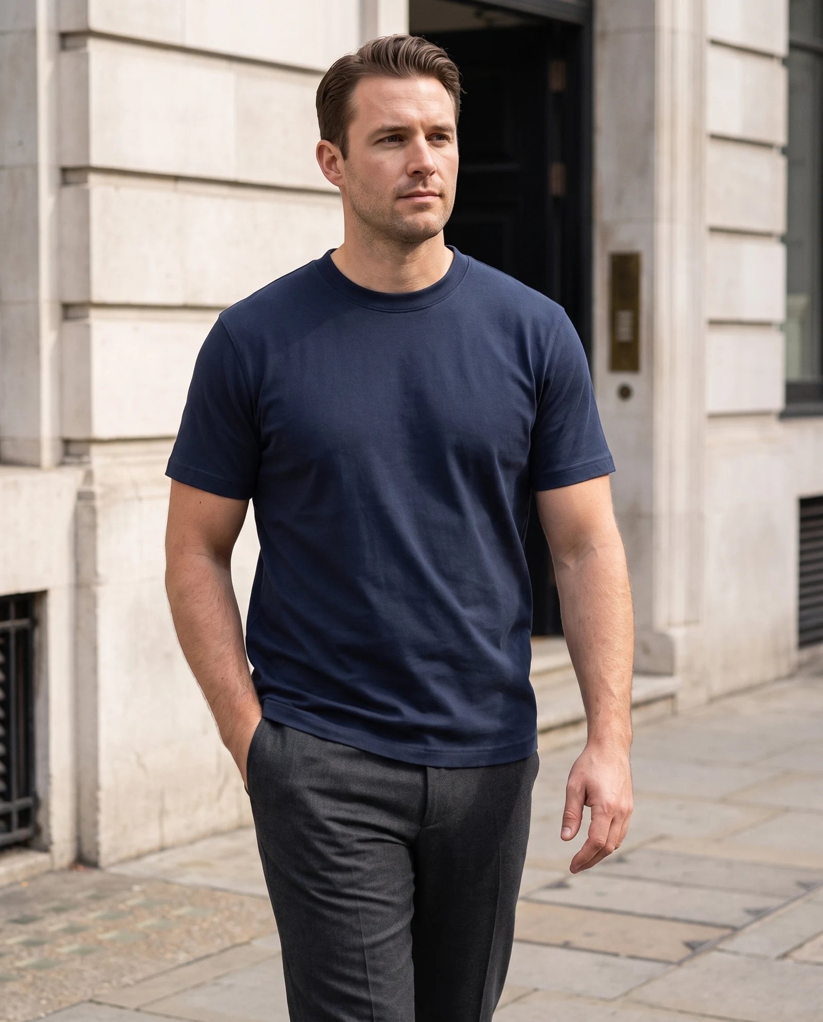 Navy tee paired with charcoal trousers outdoors